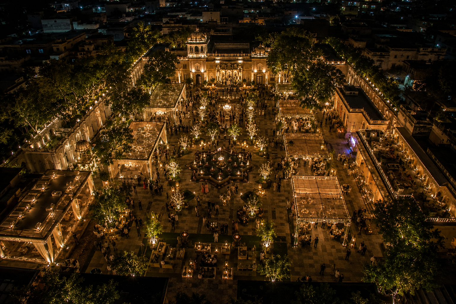 Large-scale gala in a plaza at night with thousands of lights facing a landmark building